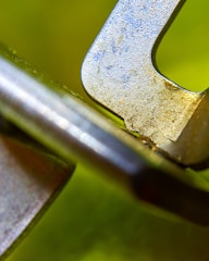 Close-up of a textured 3D object with bright yellow and blue highlights.