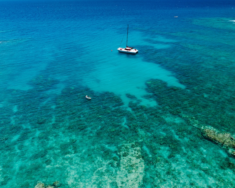 a boat floating on top of a large body of water