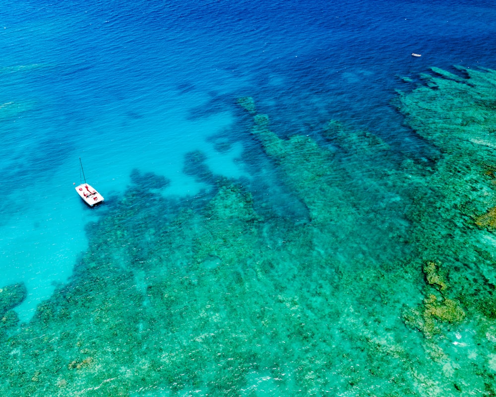 a boat floating on top of a body of water