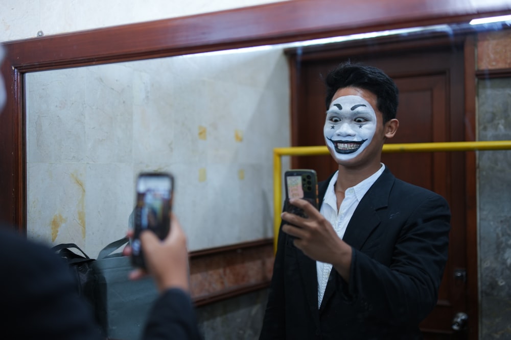 a man in a suit taking a picture of himself in a mirror