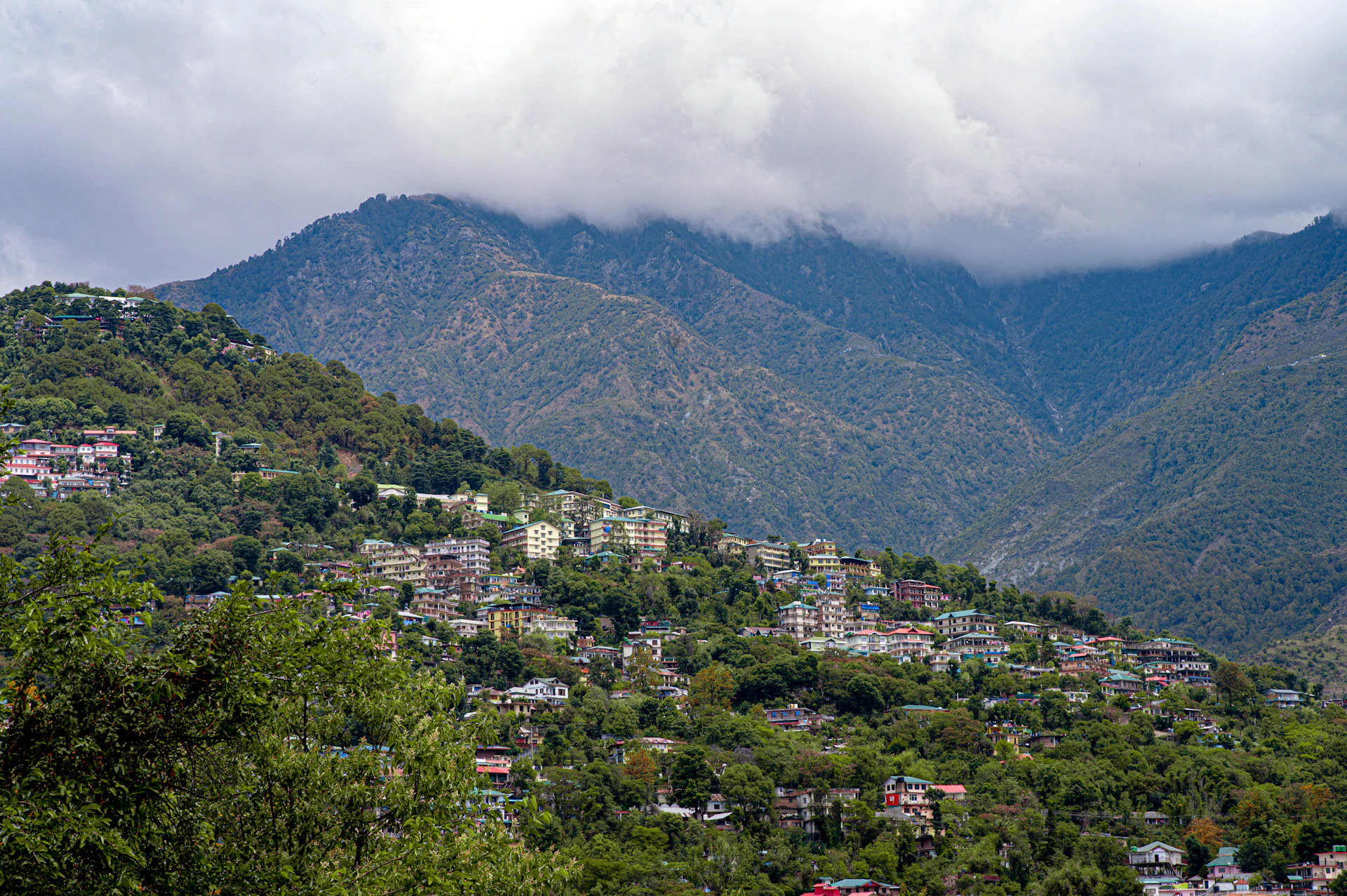 a view of a city nestled in the mountains