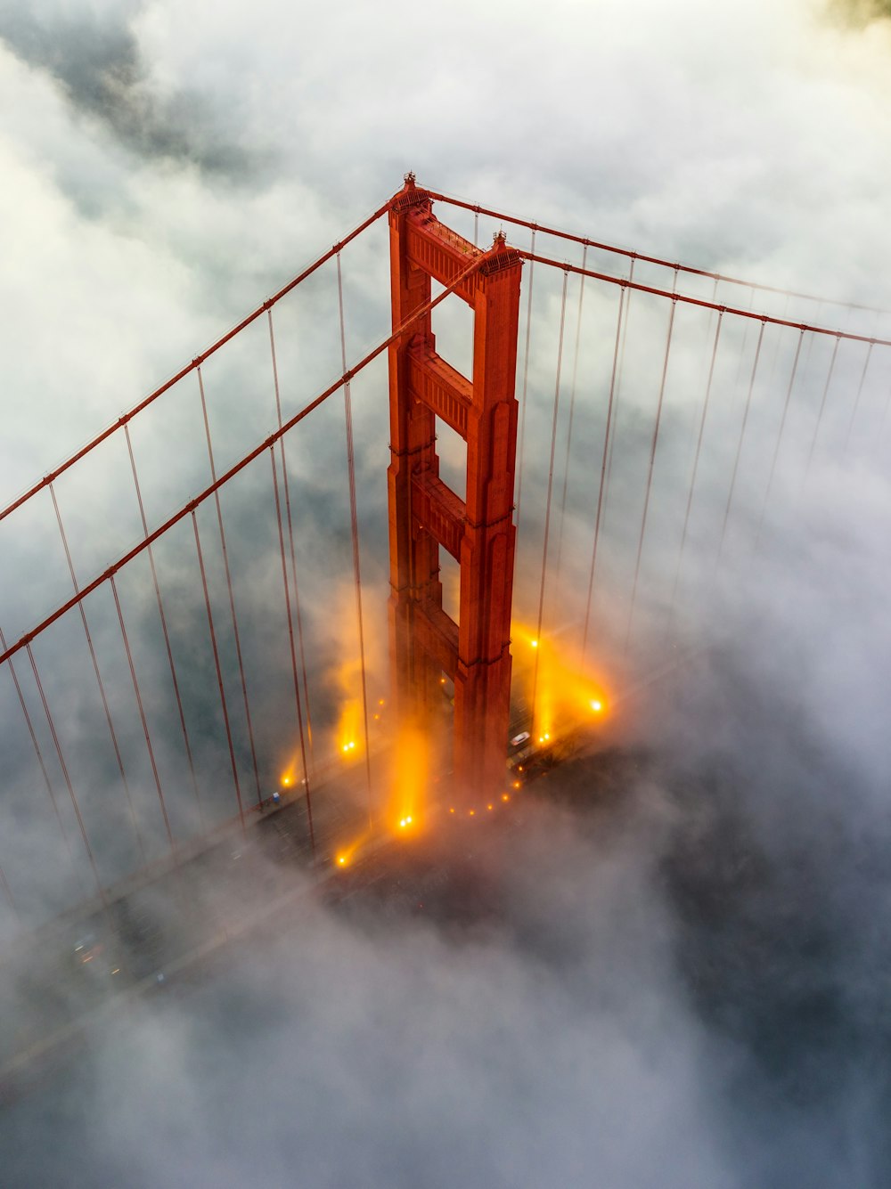 a view of the golden gate bridge from above the clouds