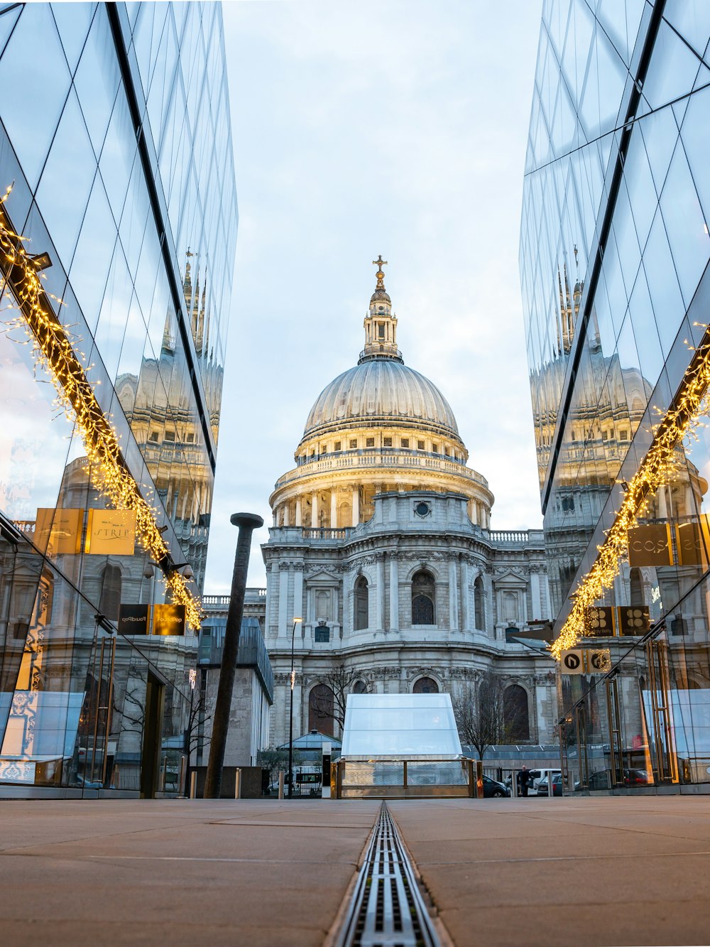 the reflection of the dome of st paul's cathedral in the windows of another
