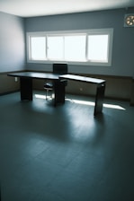 Modern minimalist office workspace with clean lines and natural light.