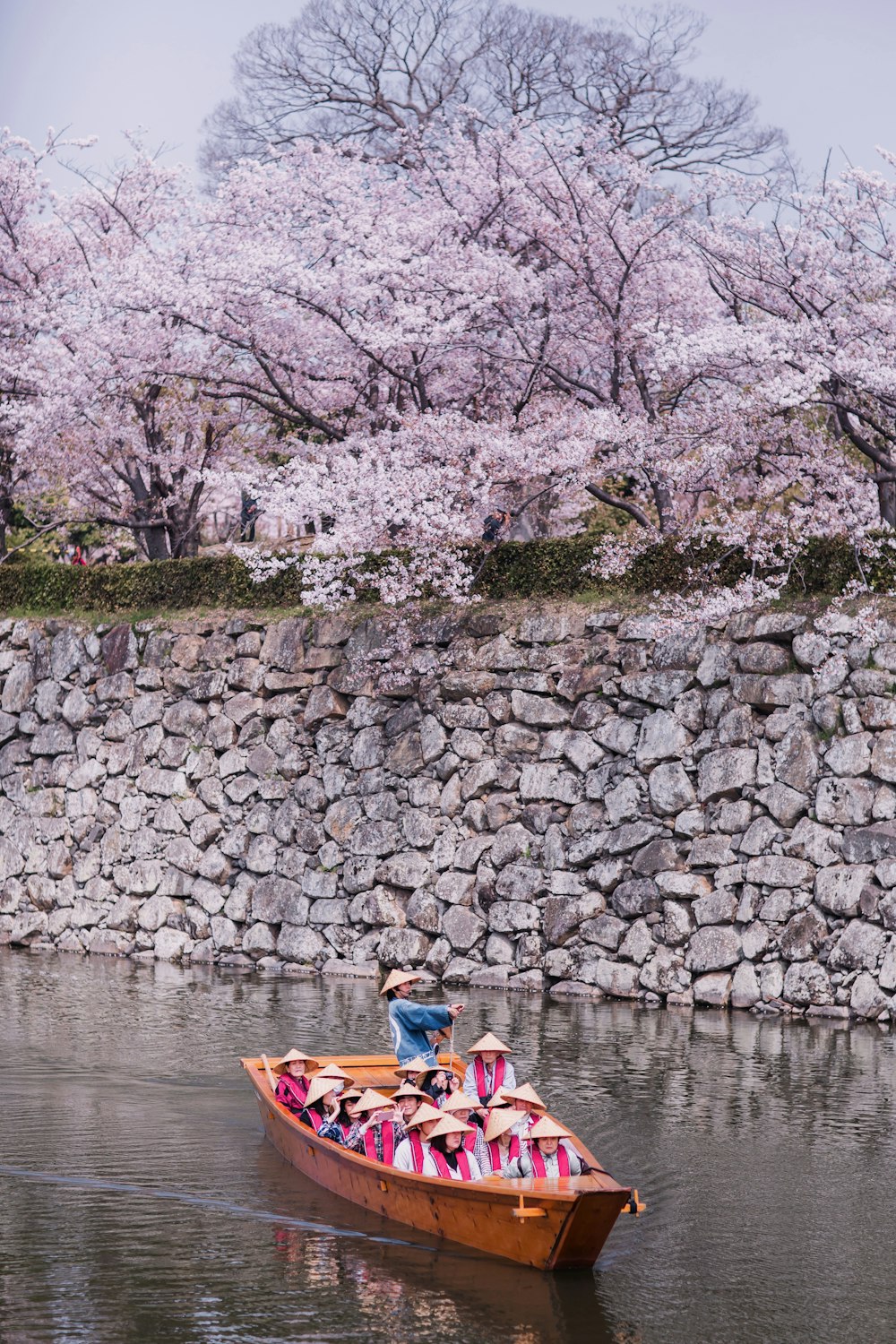 a person in a small boat on a body of water