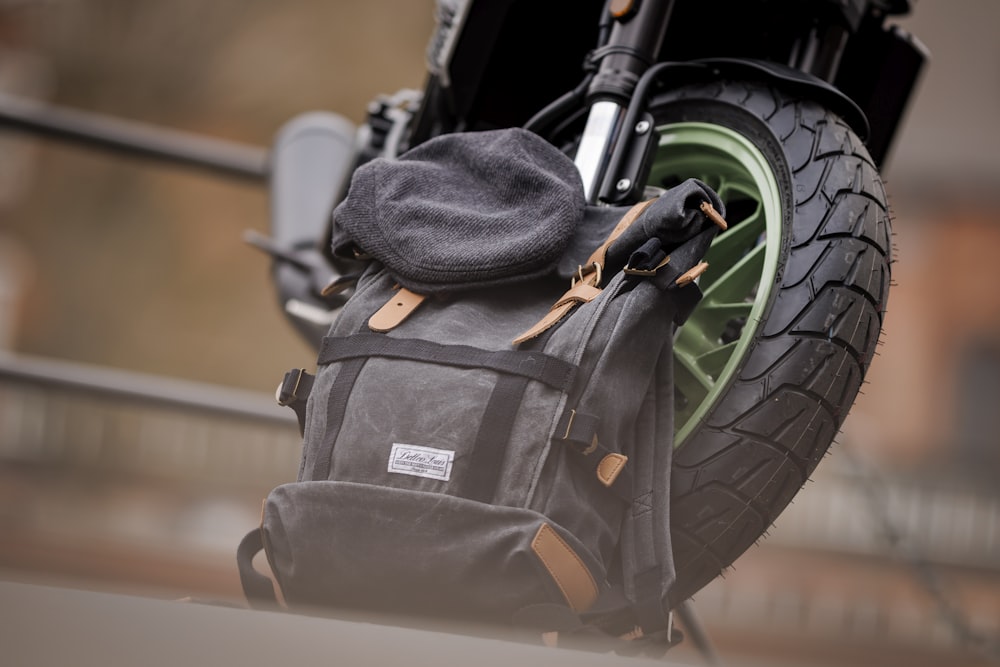 a back pack sitting on top of a motorcycle