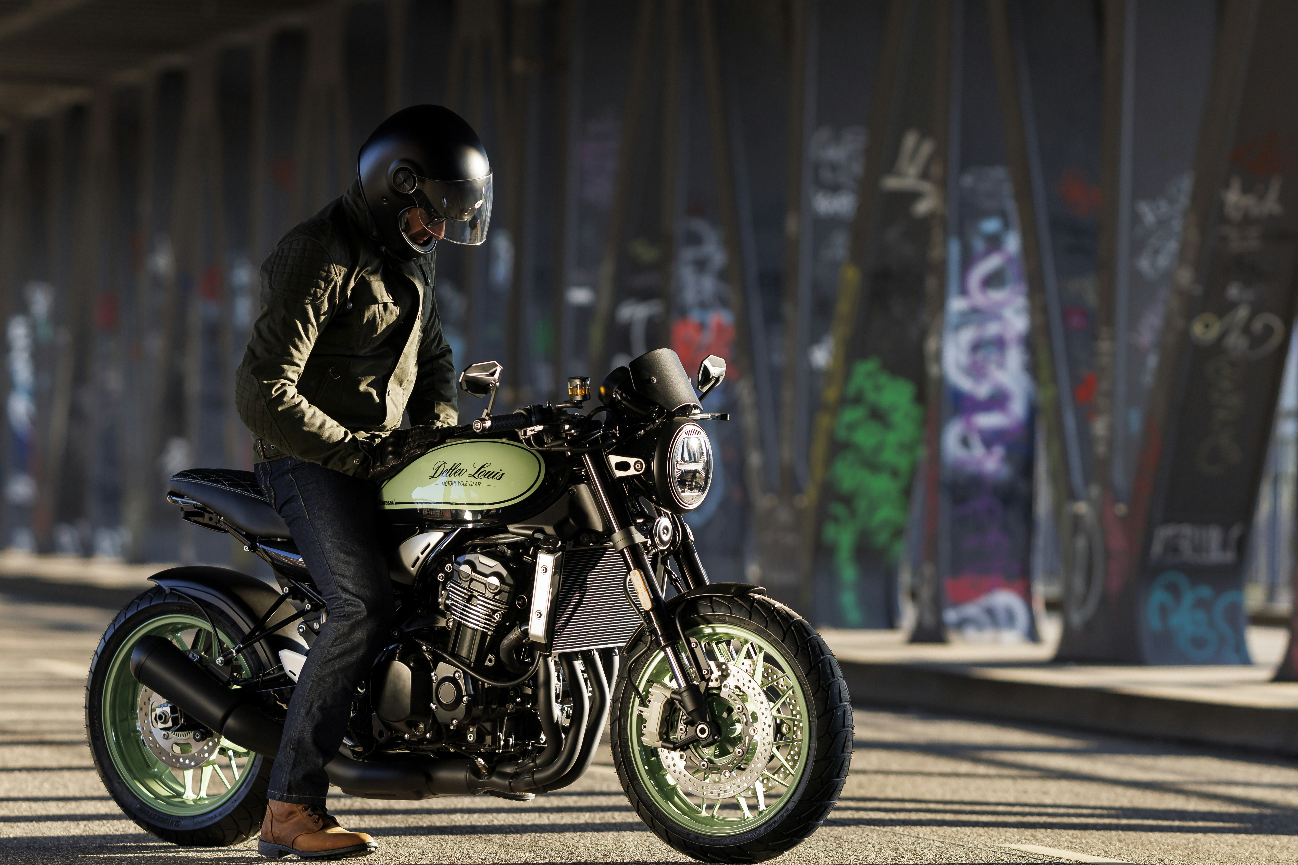 a man sitting on a motorcycle on the street