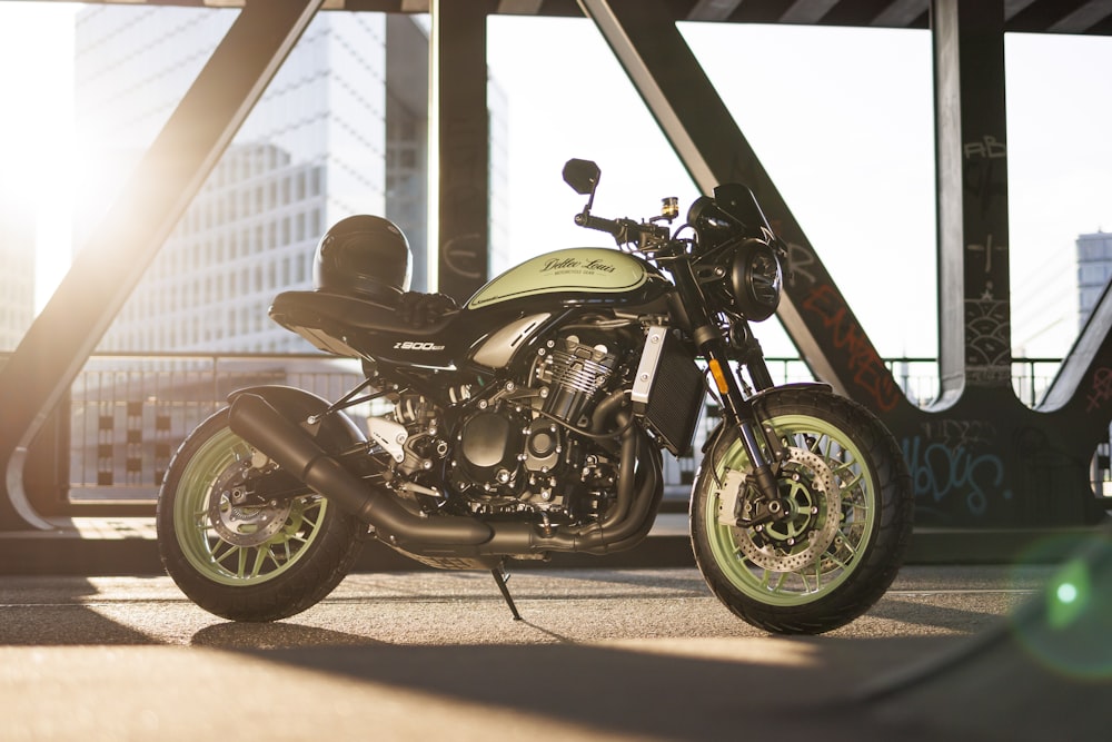 a motorcycle parked in a parking lot next to a tall building