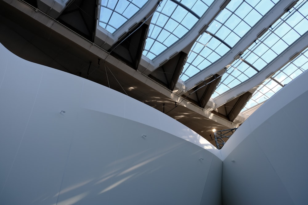 the ceiling of a building with a glass roof