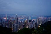 A panoramic view of Hong Kong’s skyline at dusk, highlighting the city’s role as a financial hub.