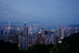 A panoramic view of Hong Kong’s skyline at dusk, highlighting the city’s role as a financial hub.
