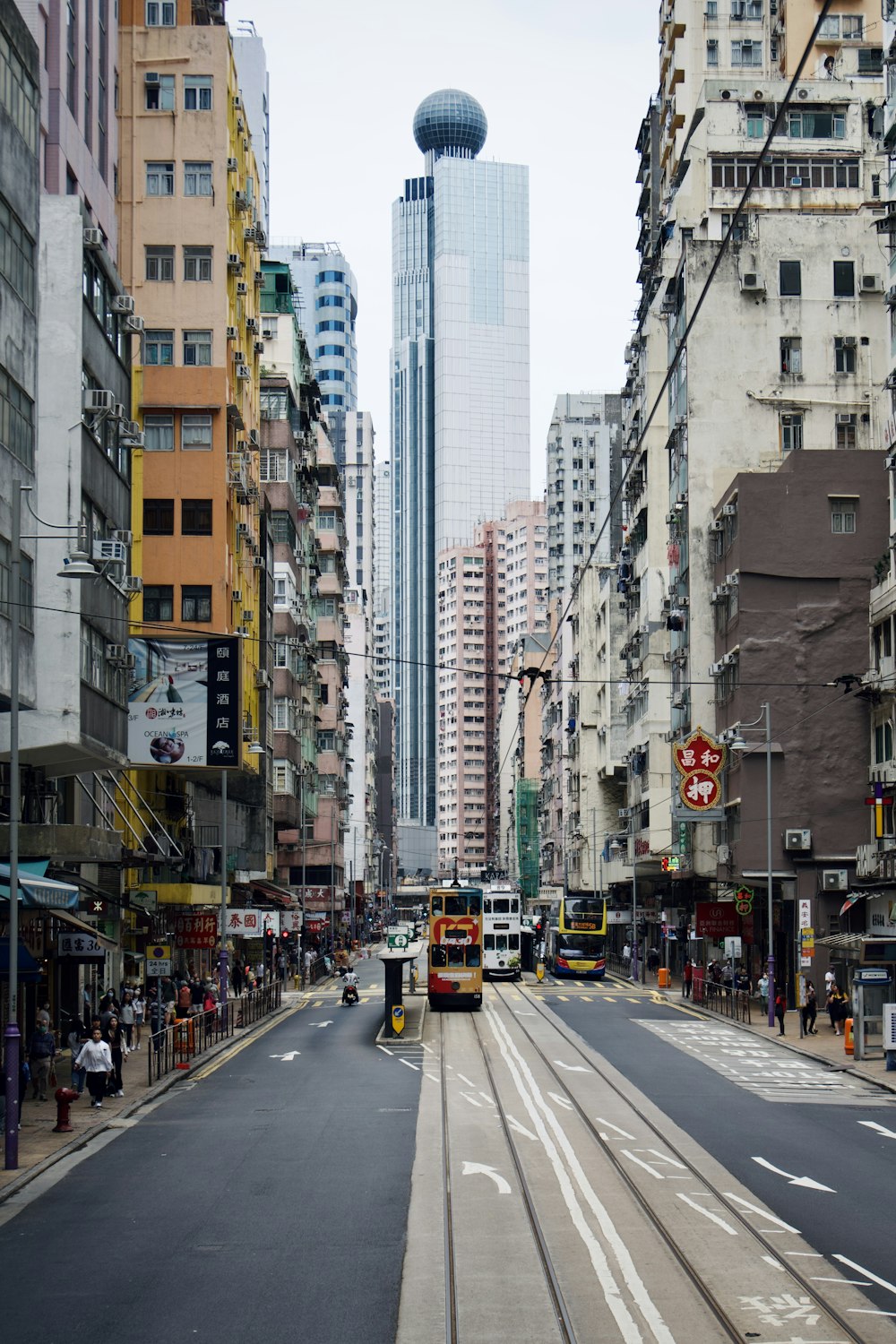 a city street filled with lots of tall buildings