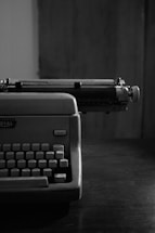 A black and white photograph of a vintage typewriter.