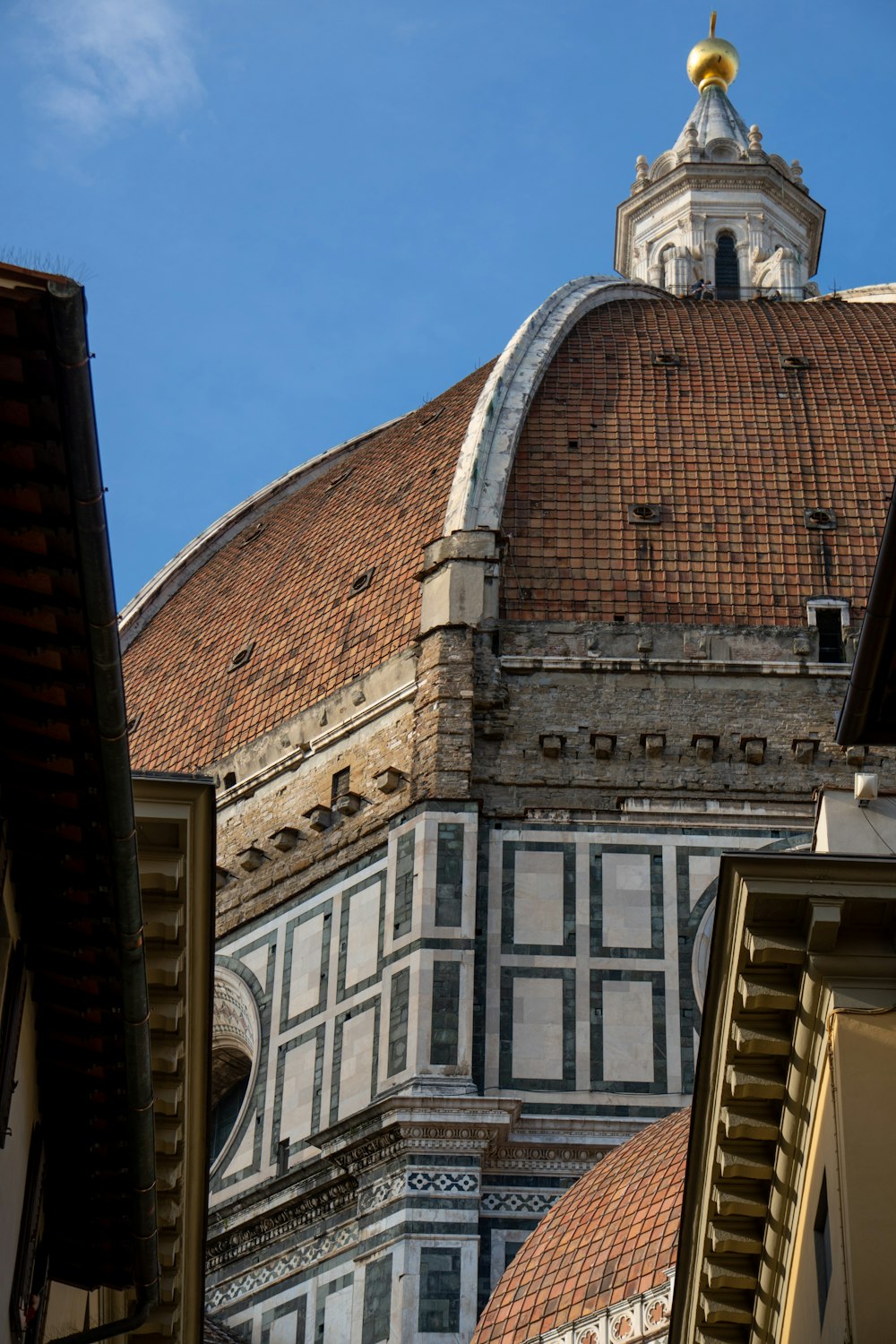 a building with a dome and a clock on it