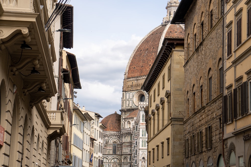 a city street with a clock tower in the background