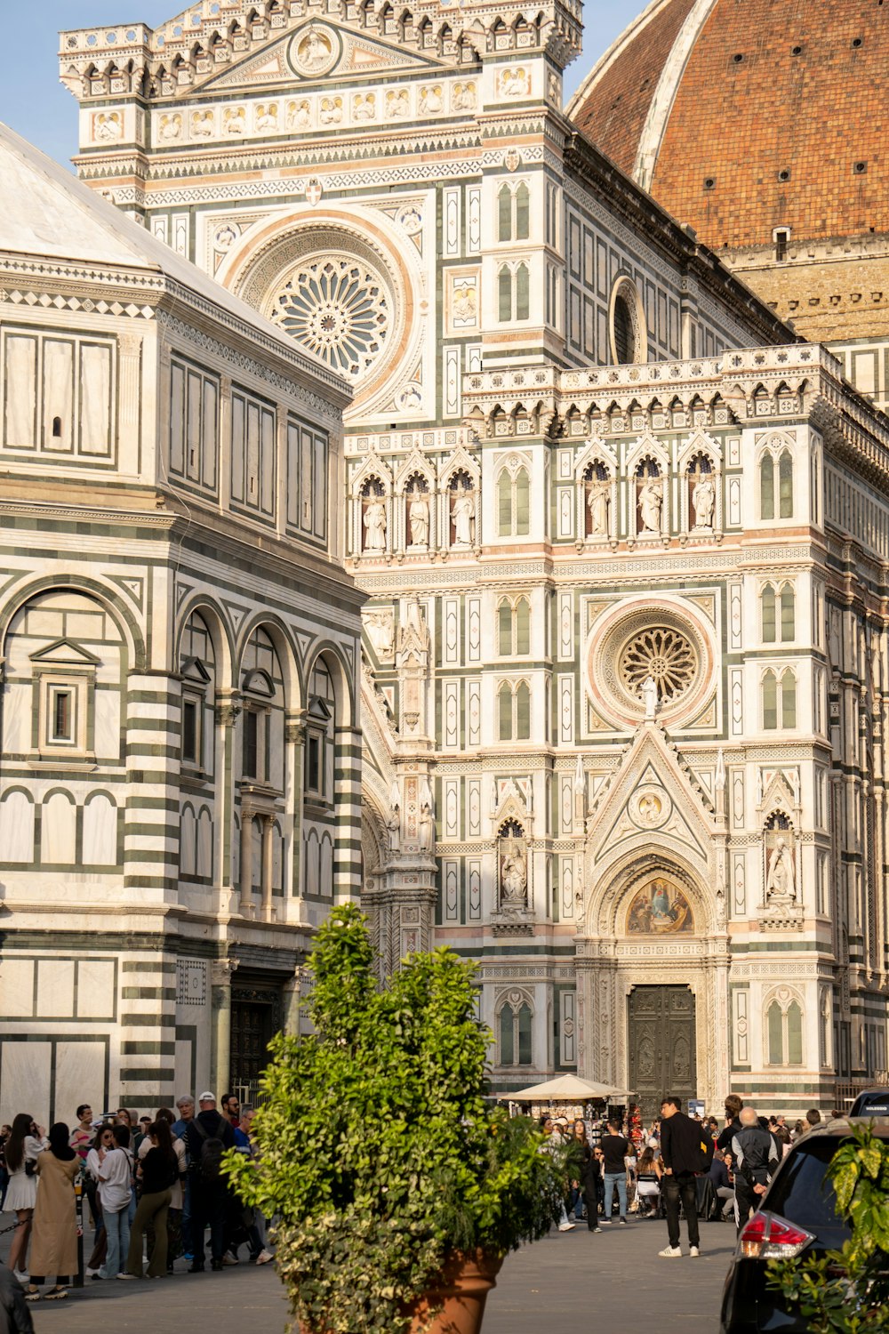 a group of people standing in front of a large building