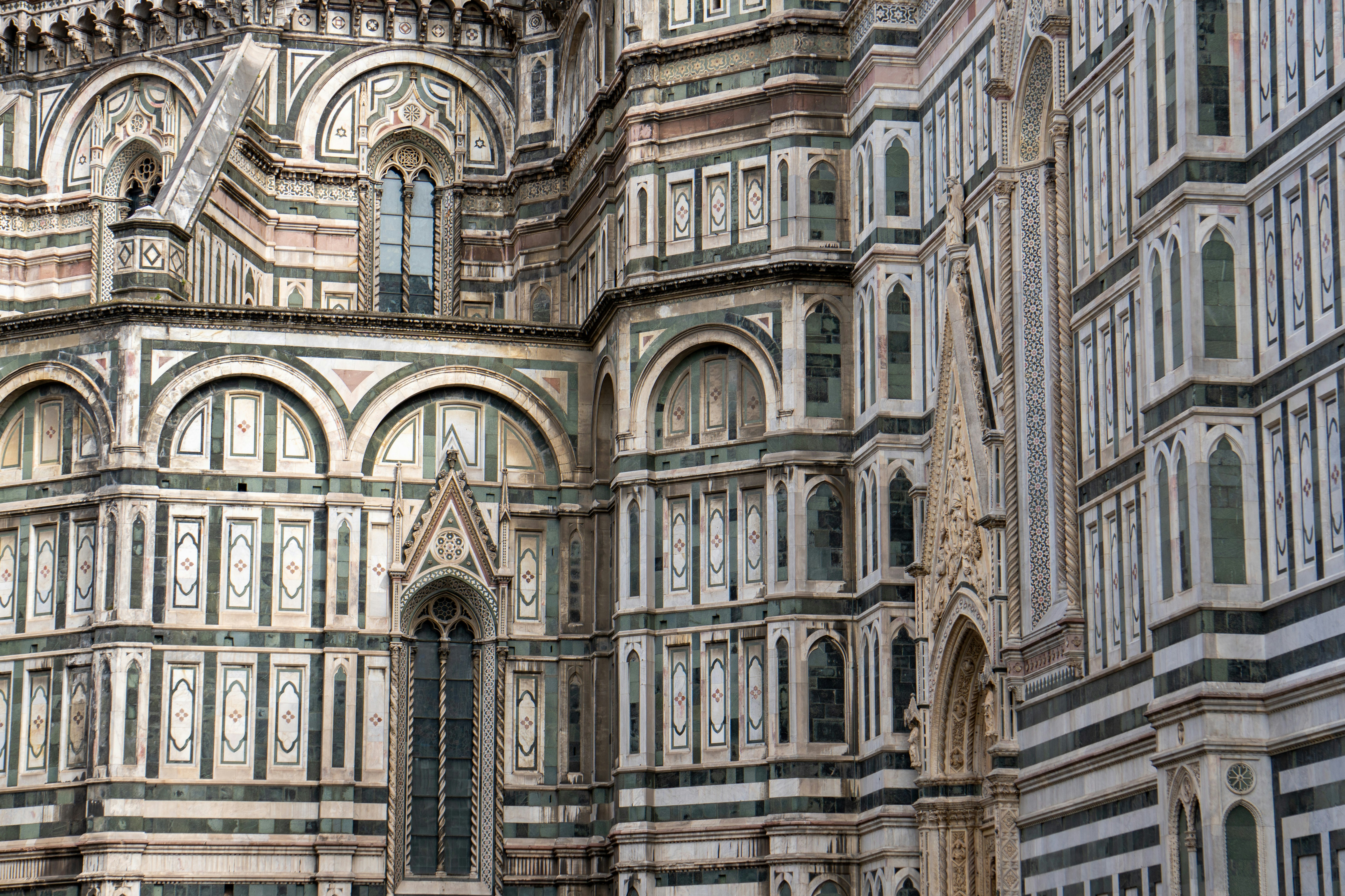 A very tall building with a clock on it's side