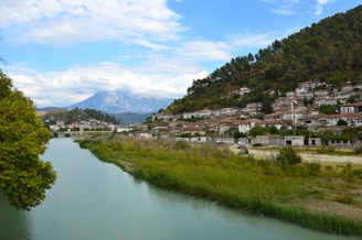 Scenic view of Rafael town with mountains in the background and a flowing river.