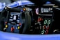 Close-up of a Pit Stop Racer laptimer and dashboard installed on a sim racing rig.