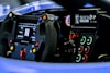 Close-up of a Pit Stop Racer laptimer and dashboard installed on a sim racing rig.