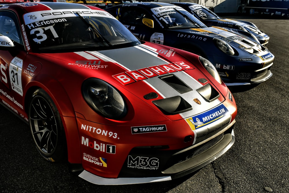 a group of racing cars parked next to each other