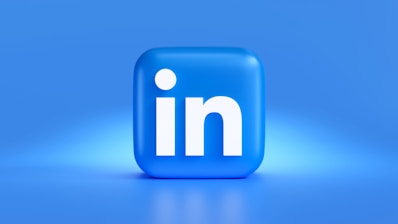 A 3D representation of the LinkedIn logo featuring a rounded blue square with the letter 'in' prominently displayed in white. The background is a gradient of blue hues, providing a clean and professional appearance.