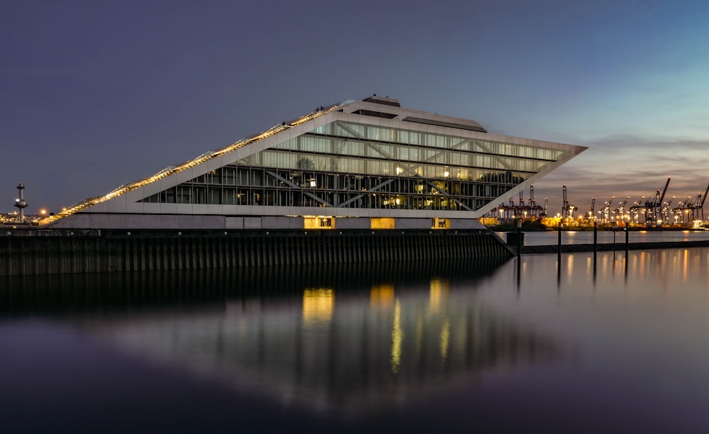 a large building sitting next to a body of water