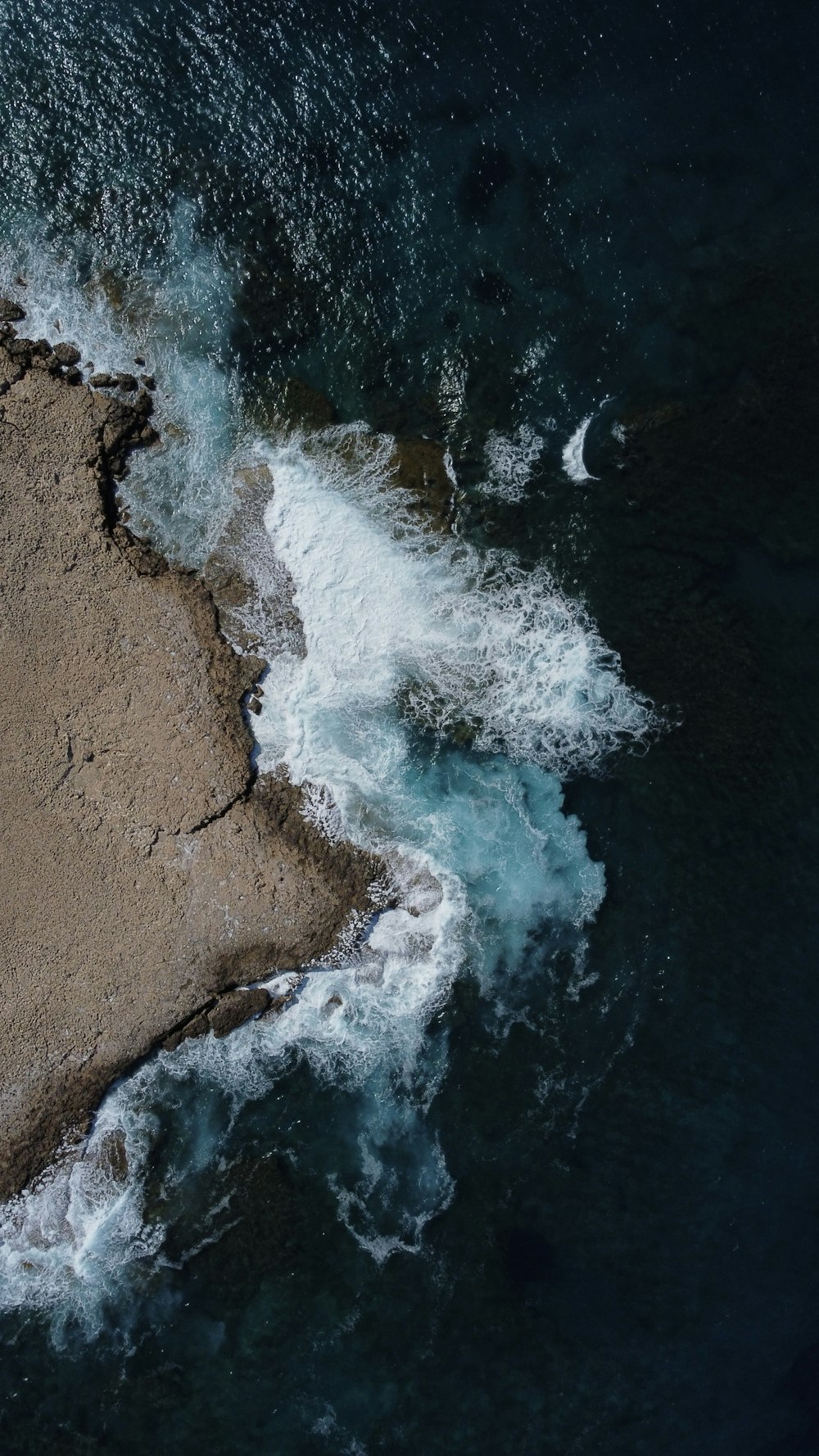 a bird's eye view of a rocky beach