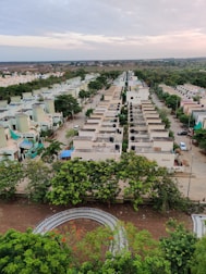 Aerial view of completed duplex homes in a quiet Varanasi neighborhood.