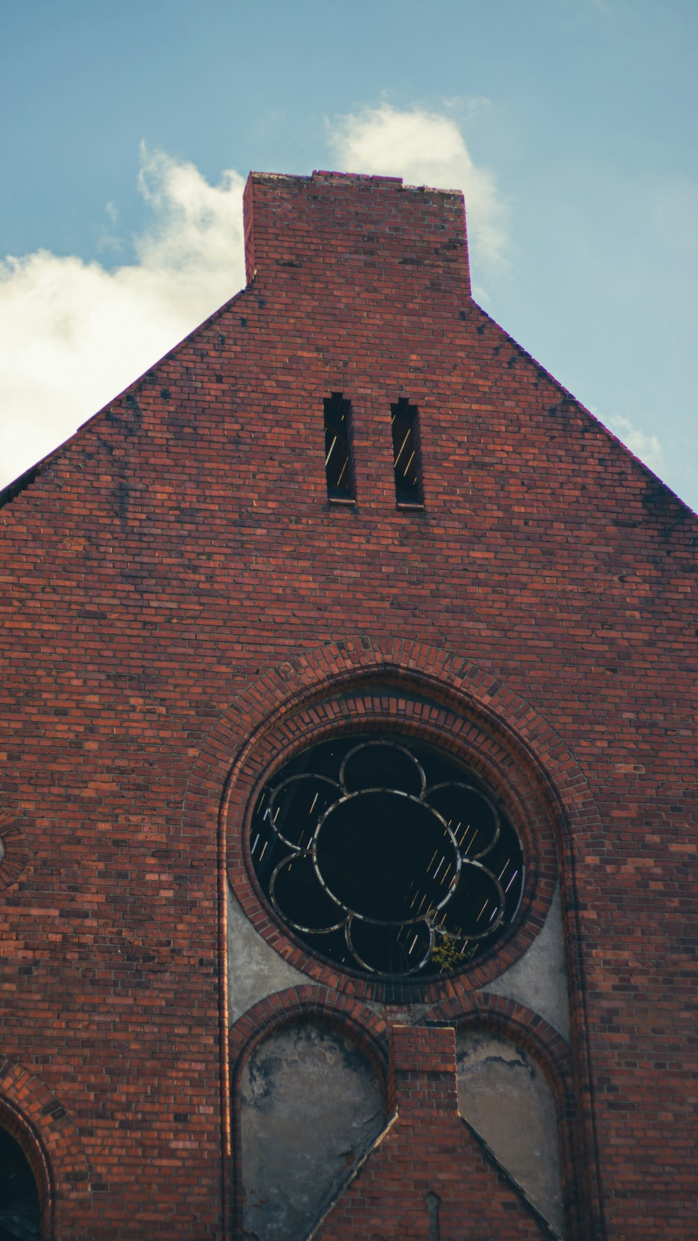 a large brick building with a clock on it's face