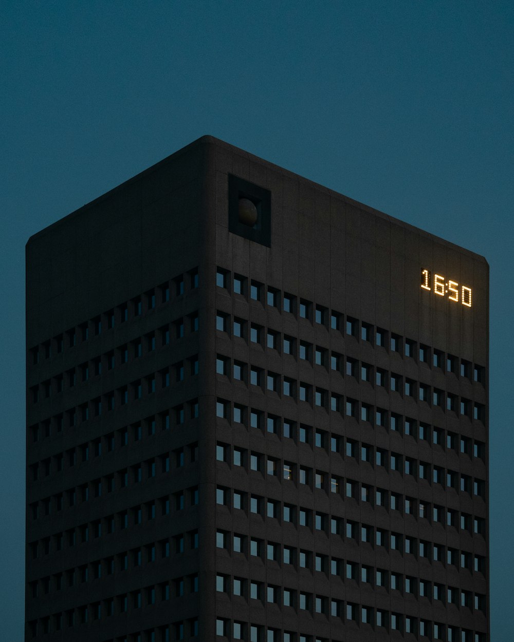 a tall building with a clock on the side of it