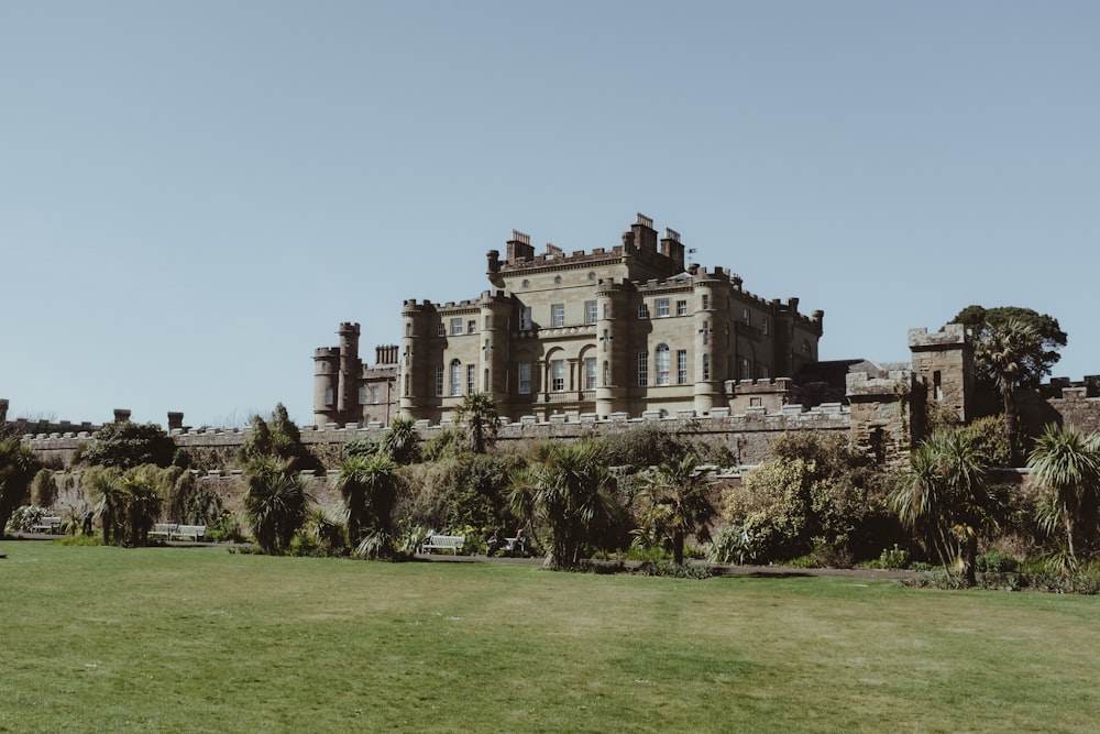 a large building with a large lawn in front of it