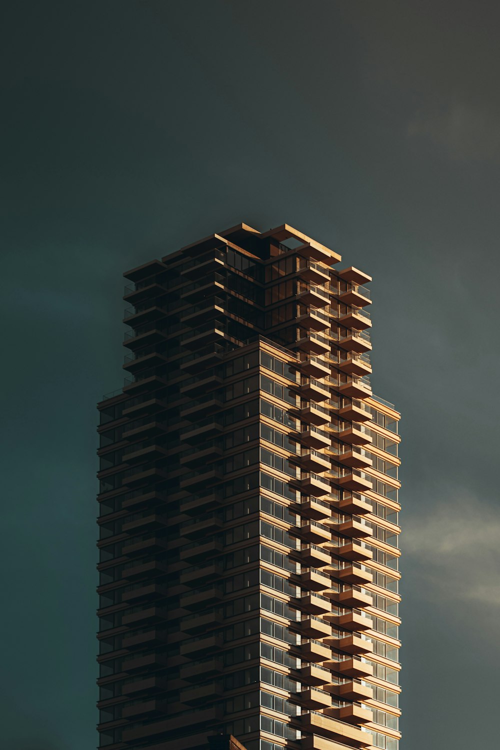 a tall building with a sky background