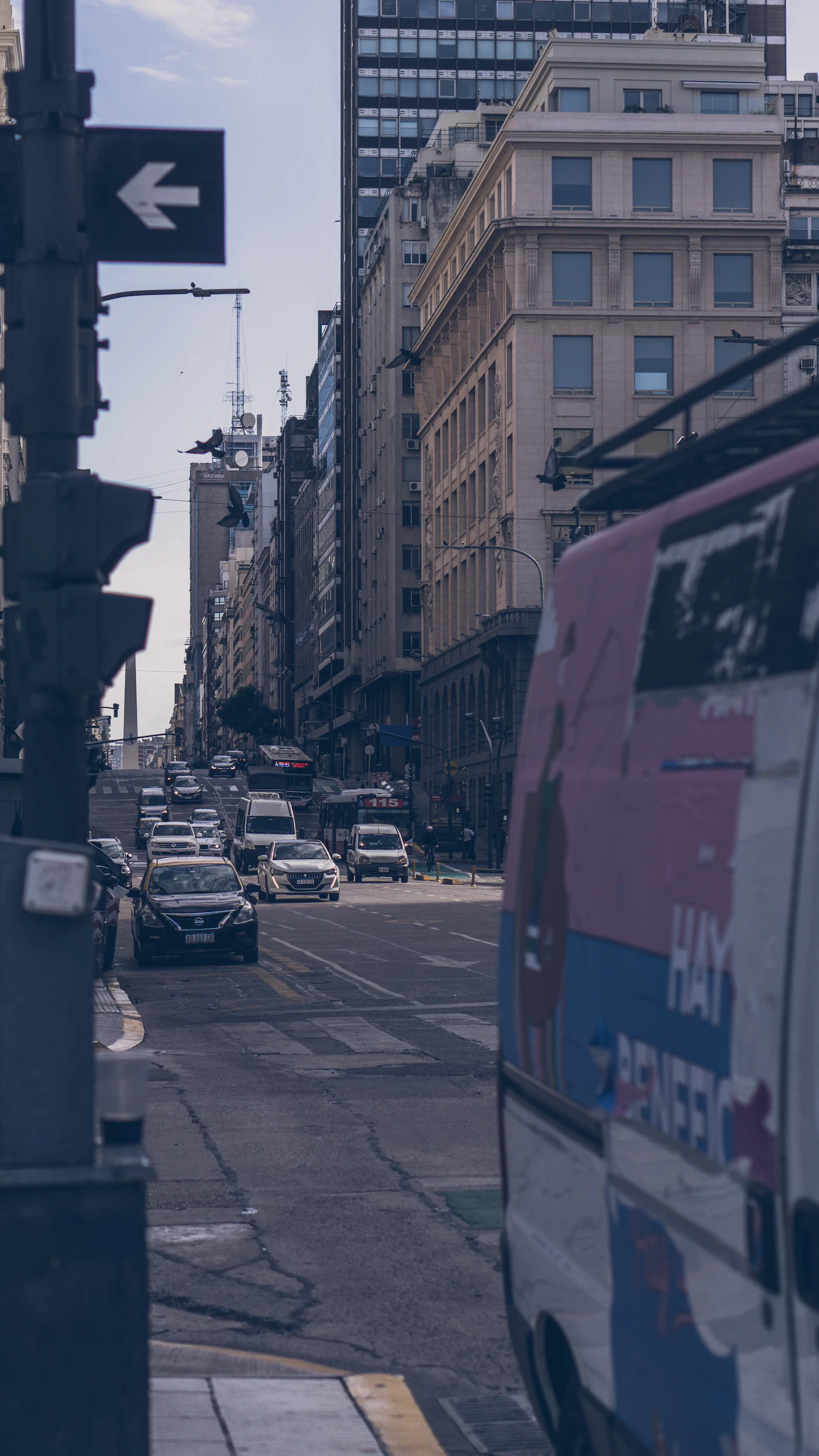 A busy Buenos Aires avenue lined with tall buildings and heavy traffic