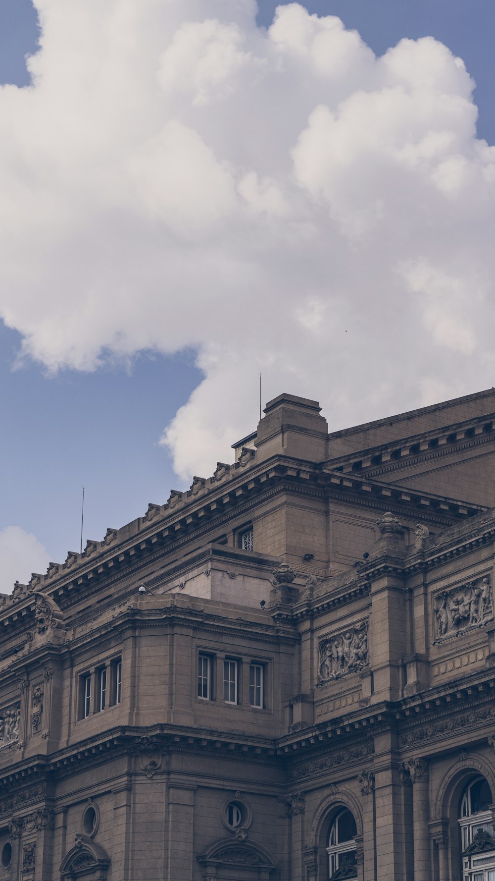 a large building with a clock on the front of it