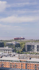 A candid photo of the diverse Hafenverve team standing confidently in front of the bustling Hamburg port.
