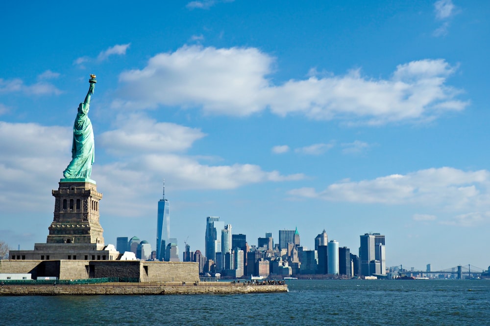 a view of the statue of liberty from across the water