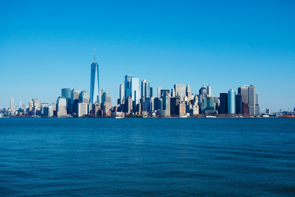 a large body of water with a city in the background