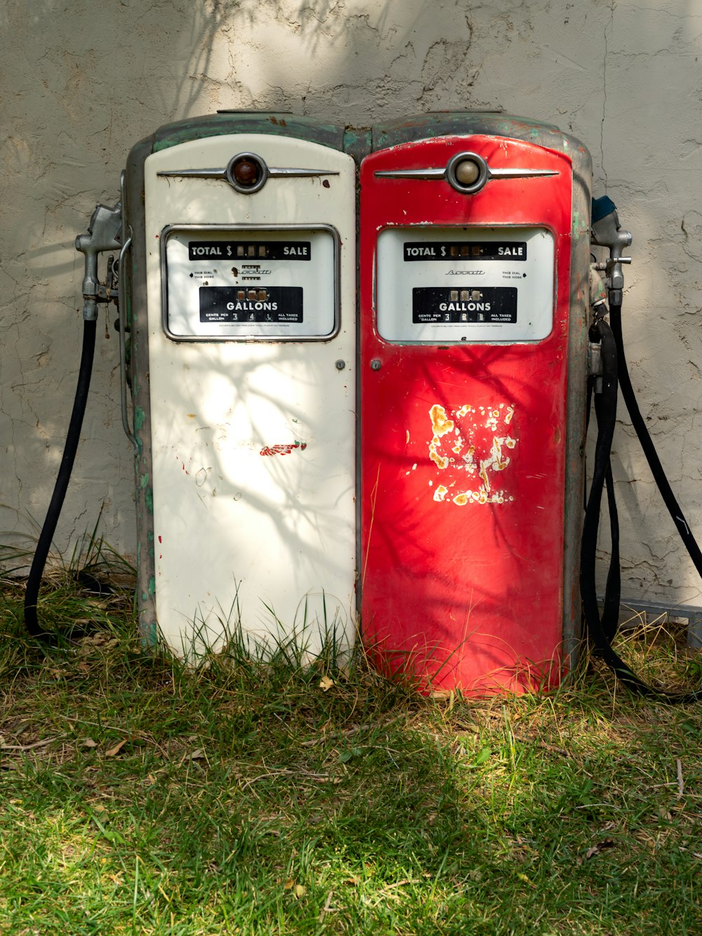 a couple of gas pumps sitting next to each other