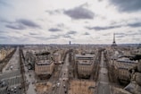 An aerial view of a bustling city with international landmarks.