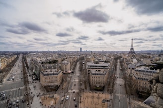 Aerial view of a busy tourist destination with travelers and landmarks.