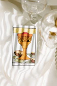 Artistic rendering of the King of Cups surrounded by swirling water and gentle waves.