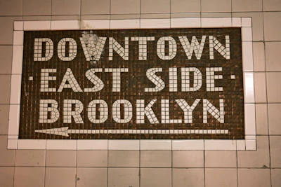 a sign that is on the side of a wall