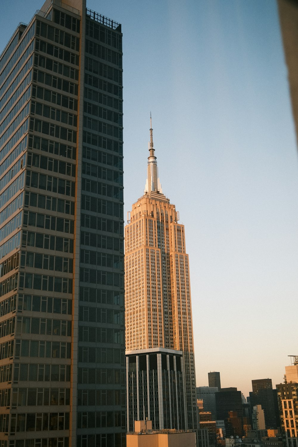 a tall building with a spire in the middle of a city