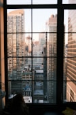 A city skyline viewed from an office window symbolizing growth and success.