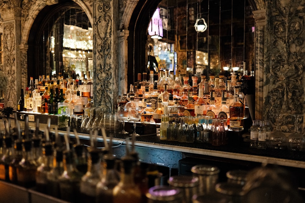 a bar filled with lots of bottles of liquor