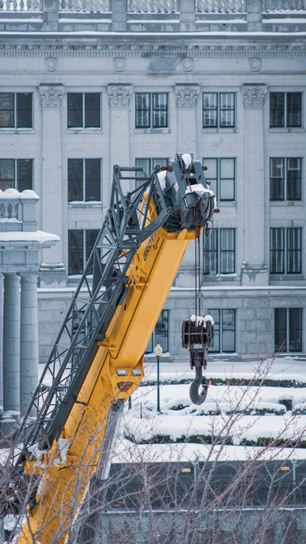a crane is lifting a building into the air