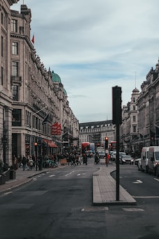 A bustling London street scene capturing everyday life under cloudy skies.