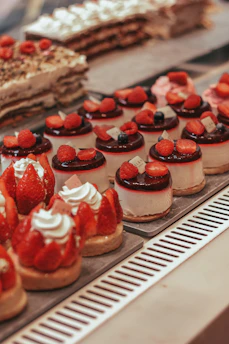 a display case filled with lots of different types of desserts
