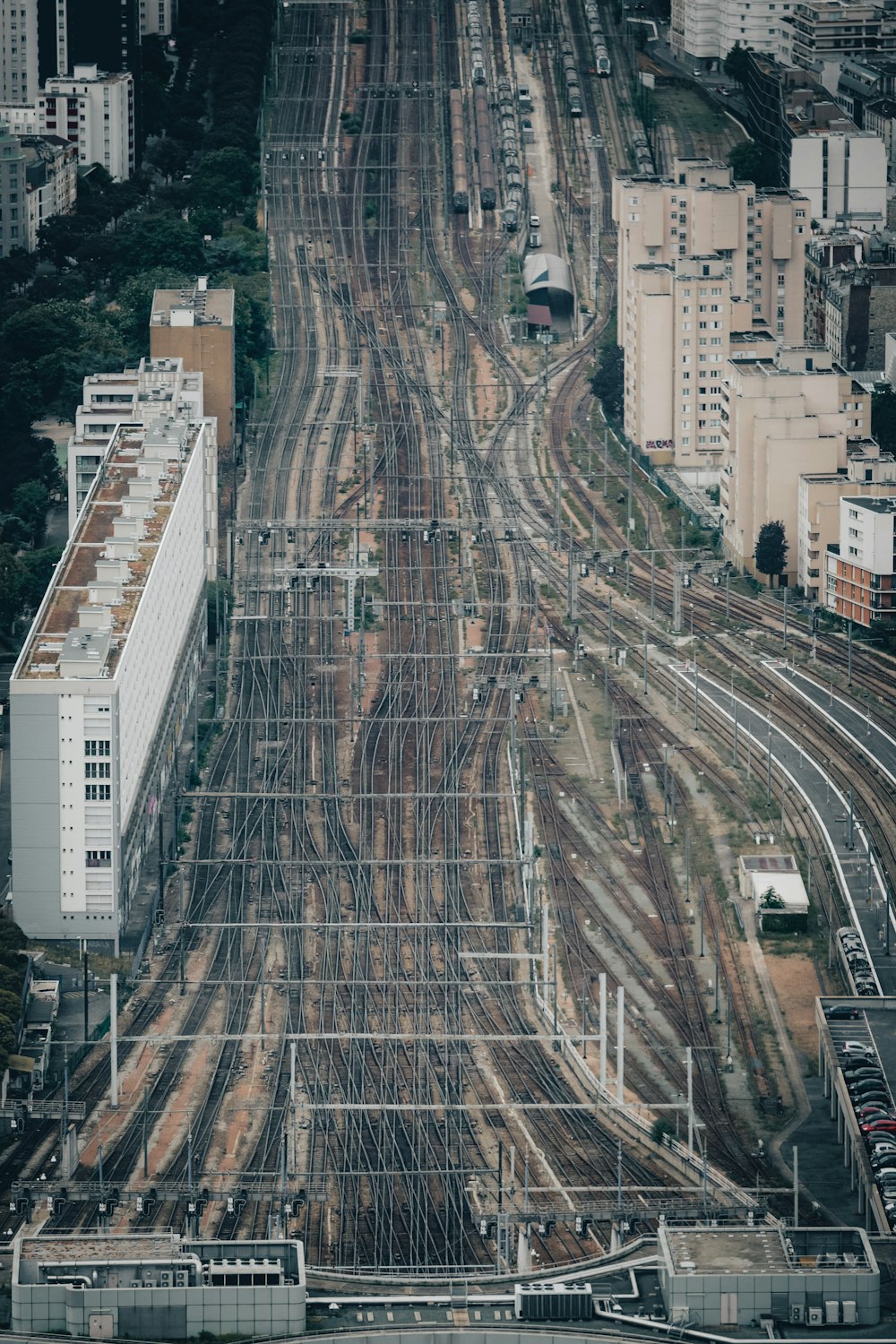 an aerial view of a train yard in a city